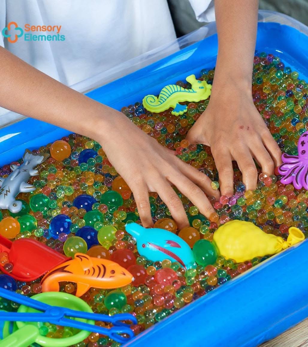 Juego sensorial de perlas de agua con accesorios